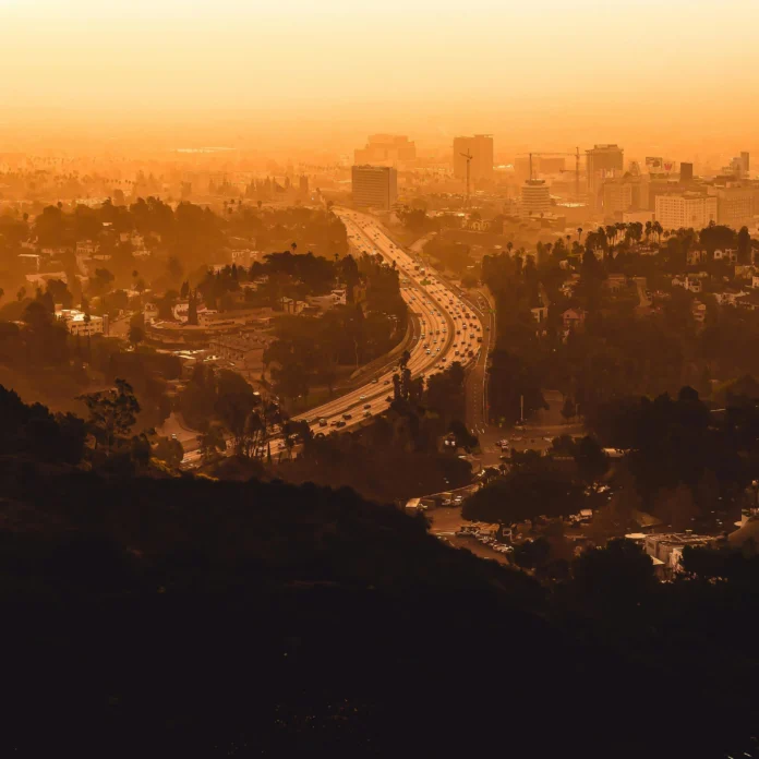 Los Angeles skyline covered in wildfire smoke and smog, viewed from the hills