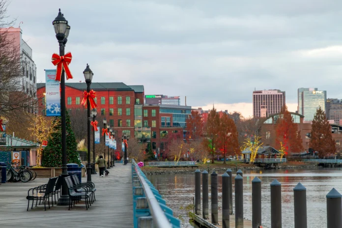 Delaware Business Entity Search illustration showing Wilmington’s Riverwalk with corporate buildings in the background