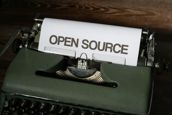 Vintage typewriter with paper labeled ‘Open Source’ symbolizing the Wisconsin public records database