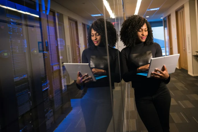 IT professional using a tablet in a data center—conceptual image representing business data access through the Nebraska Business Entity Search.