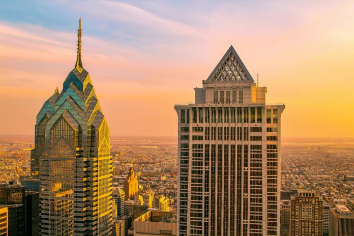 Philadelphia skyline at sunset with iconic skyscrapers, illustrating the context of the Pennsylvania Business Entity Search.