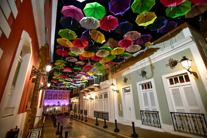 Colorful umbrellas hanging over a historic street in San Juan, Puerto Rico, illustrating the cultural backdrop for the Puerto Rico Business Entity Search.