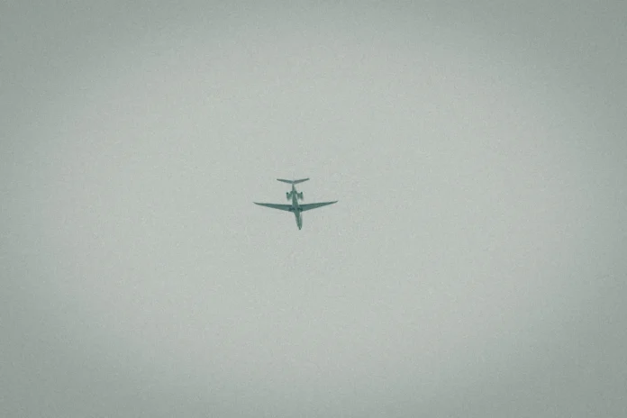Airplane viewed from below in flight, representing airflow dynamics relevant to the High-Reynolds-Number Turbulence Database.