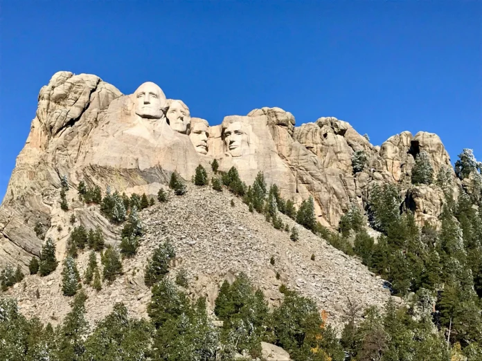 Mount Rushmore National Memorial in South Dakota with clear blue sky, used as an illustration for the South Dakota Business Entity Search guide.