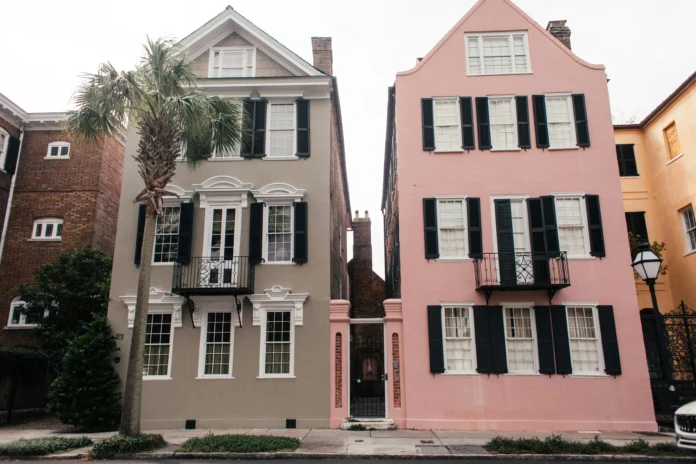 Historic Charleston townhouses with palm tree, illustrating the context of West Virginia Business Entity Search for local companies.