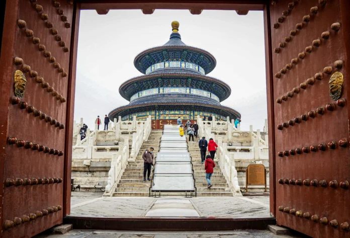 Visitors walking up the marble steps toward the Temple of Heaven in Beijing, symbolizing the cultural depth behind the China Biographical Database and its study of centuries of Chinese lives.